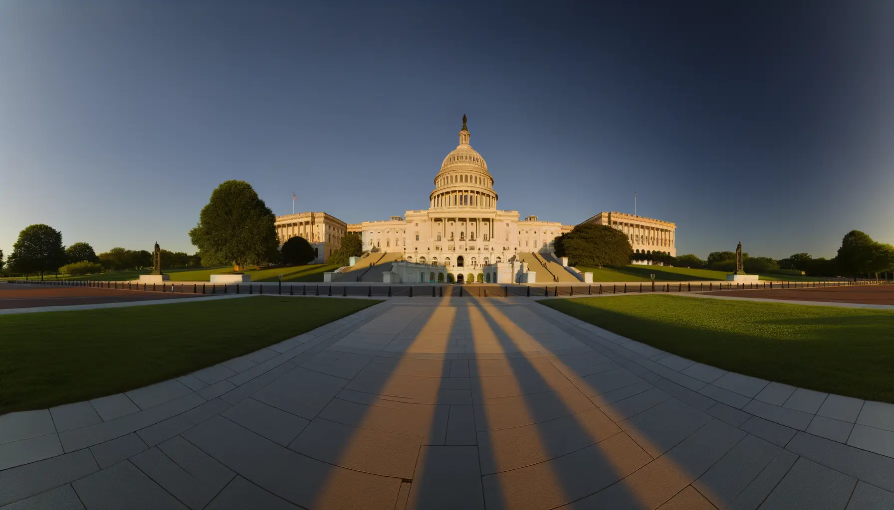 US Capitol building in Washington DC during golden hour with warm sunlight on white marble dome and columns